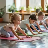 A young child performing a floor stretch on a pink yoga mat